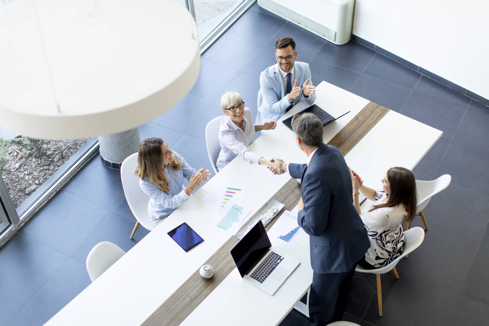 Aerial view at group of business people working together and pre